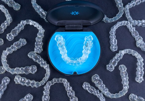 Clear aligners are seen in a case. River City Family Dentistry offers Clear Aligners in Peoria IL.