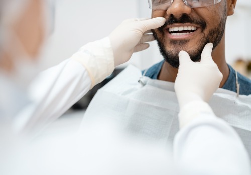 A patient gets his teeth checked out after getting Teeth Whitening in East Peoria IL