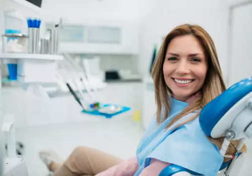 A woman is seen in the dental chair. River City Family Dentistry is a local dentist. 