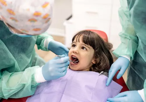 A little girl is seen in the dental chair. River City Family Dentistry is a Local Dentists East Peoria IL